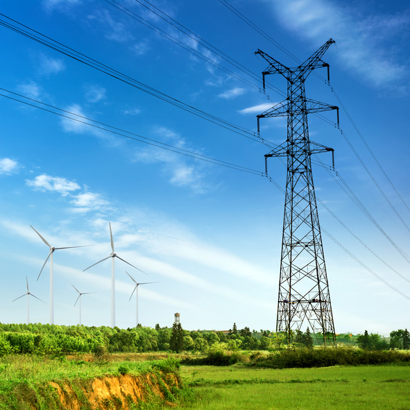 Landscape of electricity pylon and wind turbines
