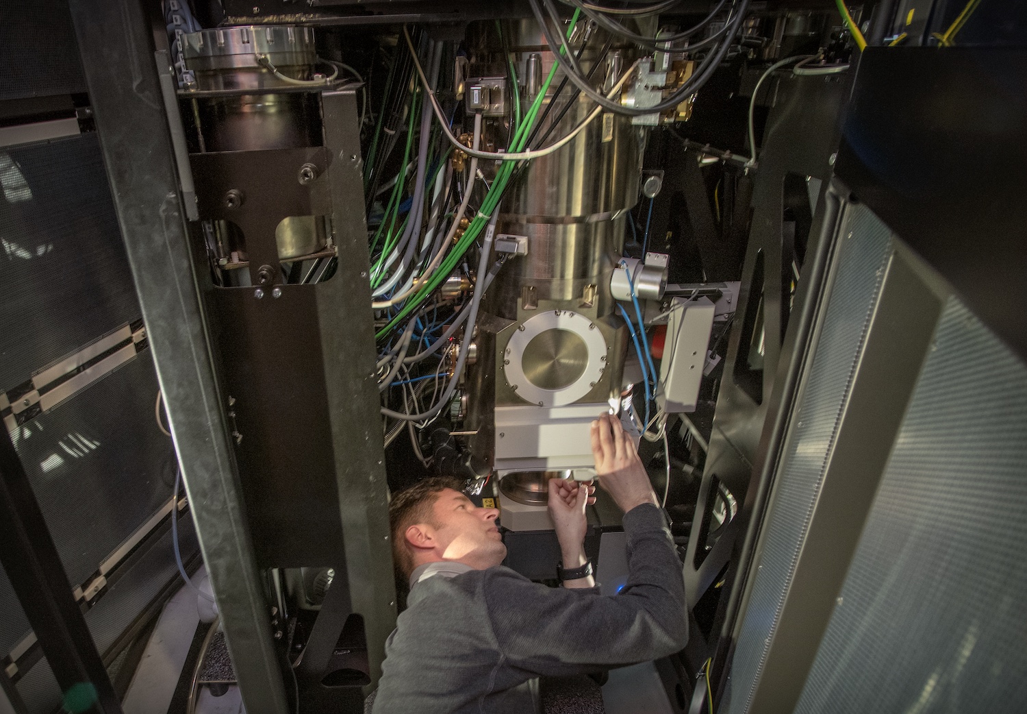 Photo - A technician works on the TEAM 0.5 microscope. The microscope has been upgraded with a superfast detector called the 4D Camera that can capture atomic-scale images in millionths-of-a-second increments. (Credit: Thor Swift/Berkeley Lab)