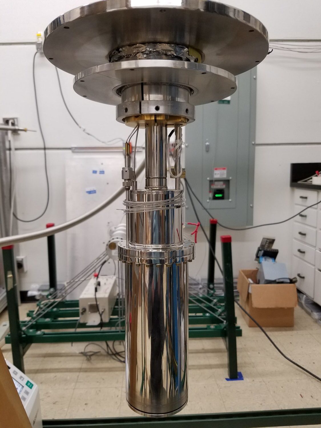 Photo - Equipment for a planned low-mass dark matter experiment, including a tank that will hold supercooled liquid helium. (Credit: Junsong Lin/Berkeley Lab, UC Berkeley)