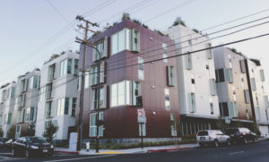 A variety of wall colors on residential buildings in Berkeley, California. (Credit: Solar-Reflective “Cool” Walls: Benefits, Technologies, and Implementation, Appendix P/California Energy Commission)