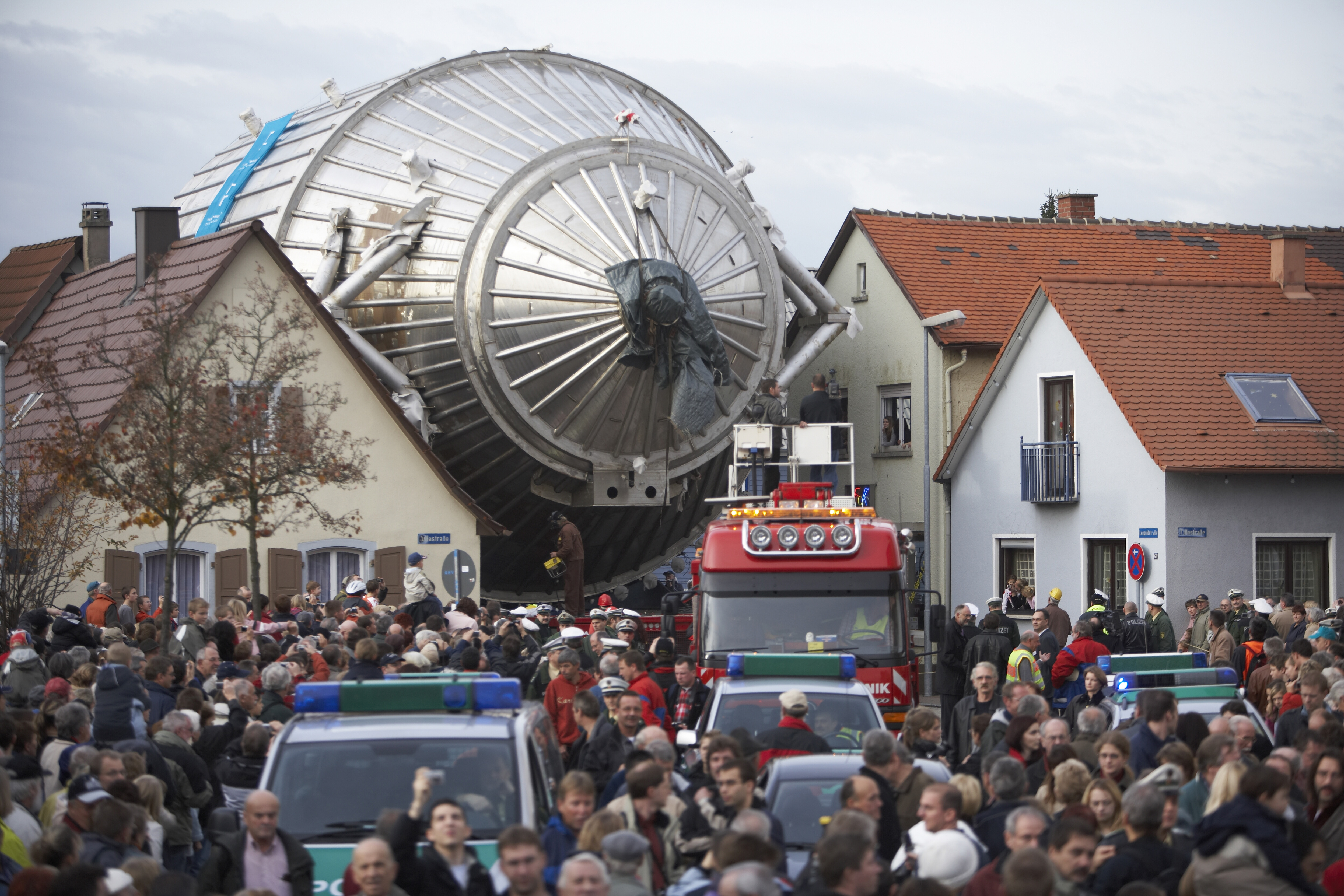 Photo - The spectrometer for the KATRIN experiment, as it works its way through the German town of Eggenstein-Leopoldshafen in 2006 on its way to the nearby Karlsruhe Institute of Technology. (Credit: Karlsruhe Institute of Technology)