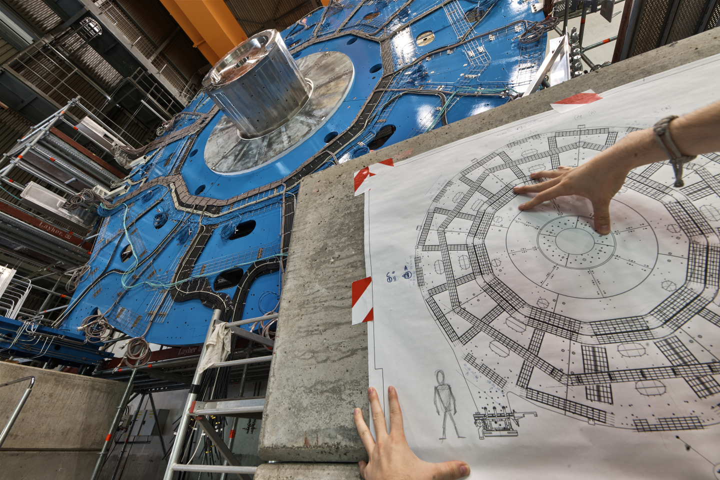 Photo - A new wheel-shaped muon detector is part of the ATLAS detector upgrade at CERN. This wheel-shaped detector measures more than 30 feet in diameter. (Credit: Julien Marius Ordan/CERN)