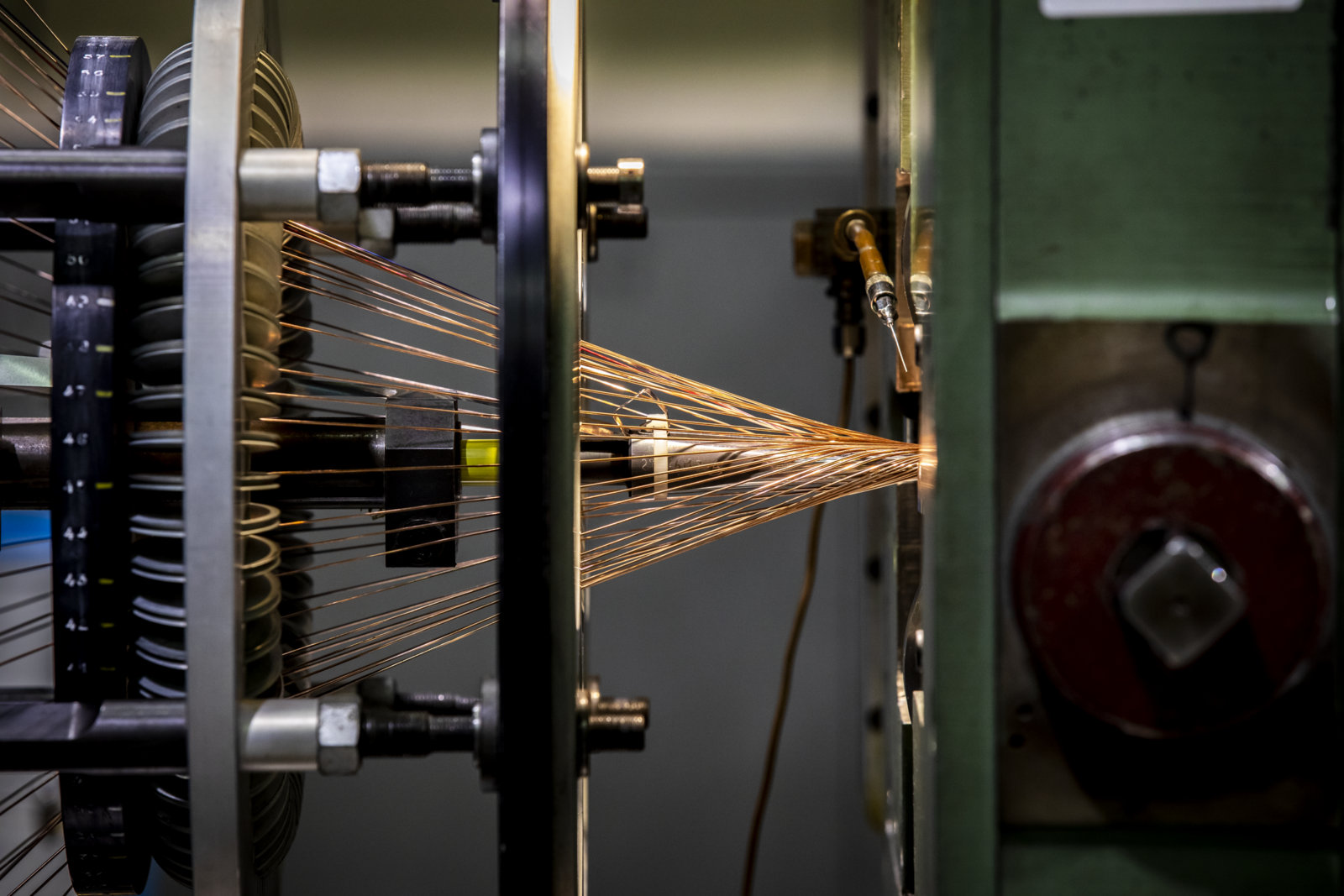 Photo - Spools of wire are wound into thinly pressed strips of cable at Berkeley Lab. (Credit: Marilyn Sargent/Berkeley Lab)