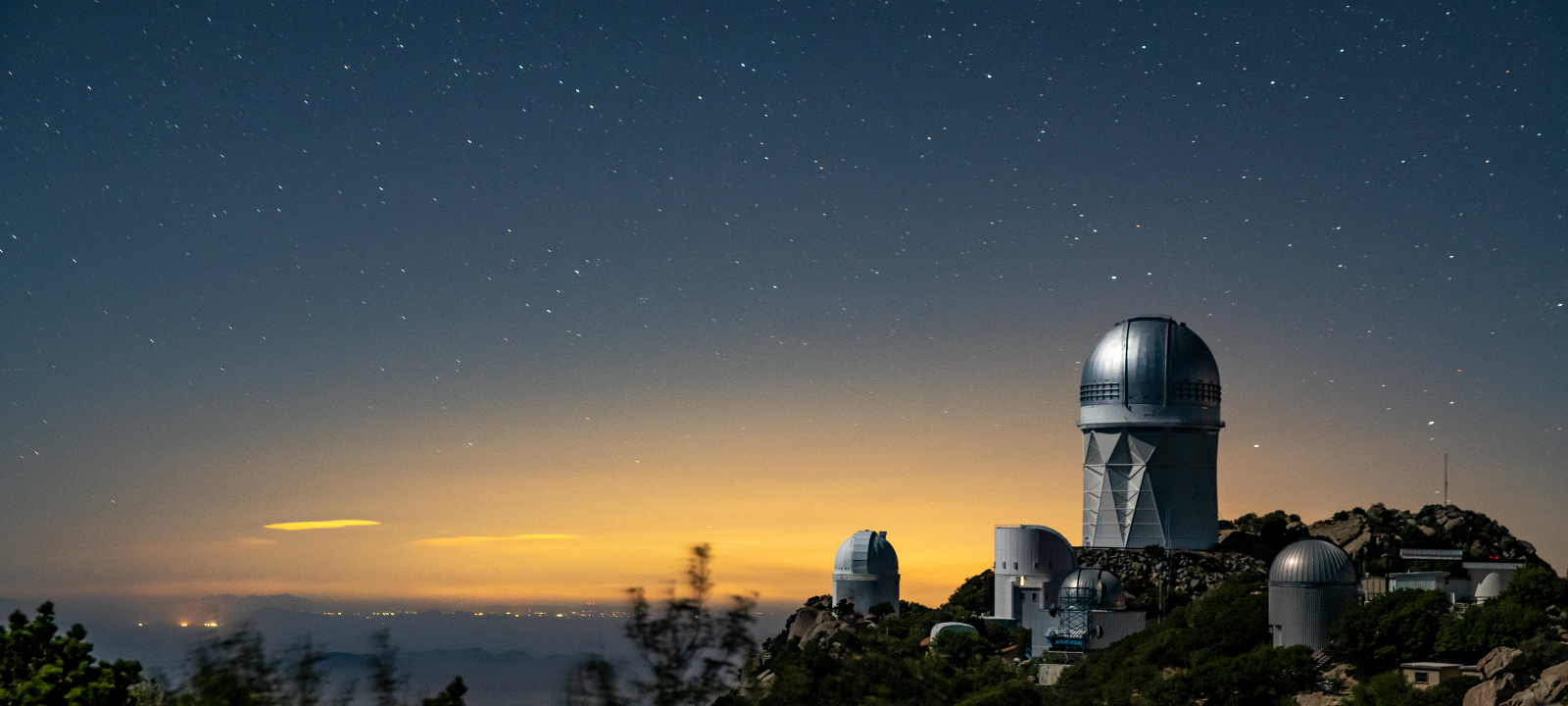 Photo - A view of the Mayall Telescope (tallest structure) at Kitt Peak National Observatory near Tucson. The Dark Energy Spectroscopic Instrument is housed within the Mayall dome. (Credit: Marilyn Sargent/Berkeley Lab)