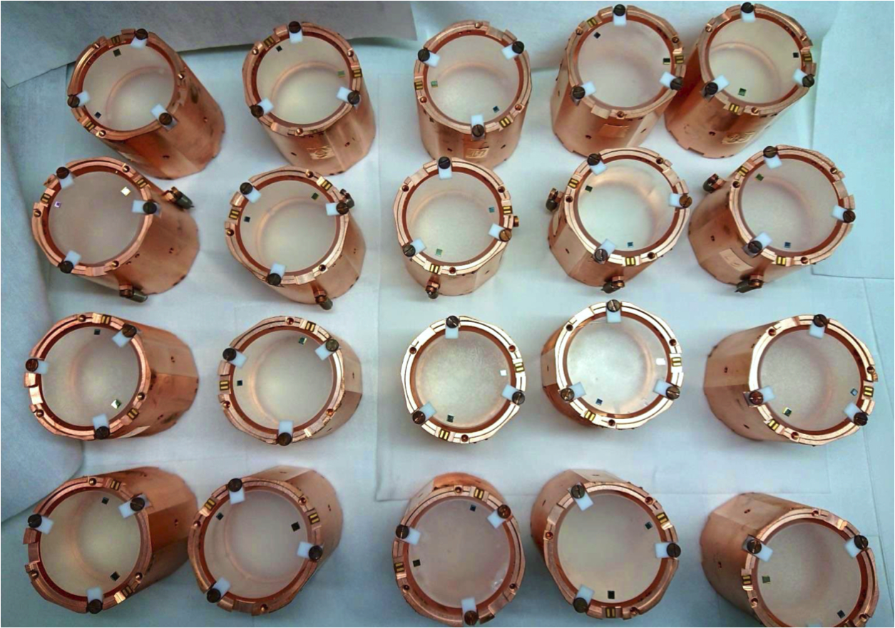 Photo - CUPID-Mo's 20 cylindrical crystals are pictured in their copper casing. (Credit: CUPID-Mo collaboration)