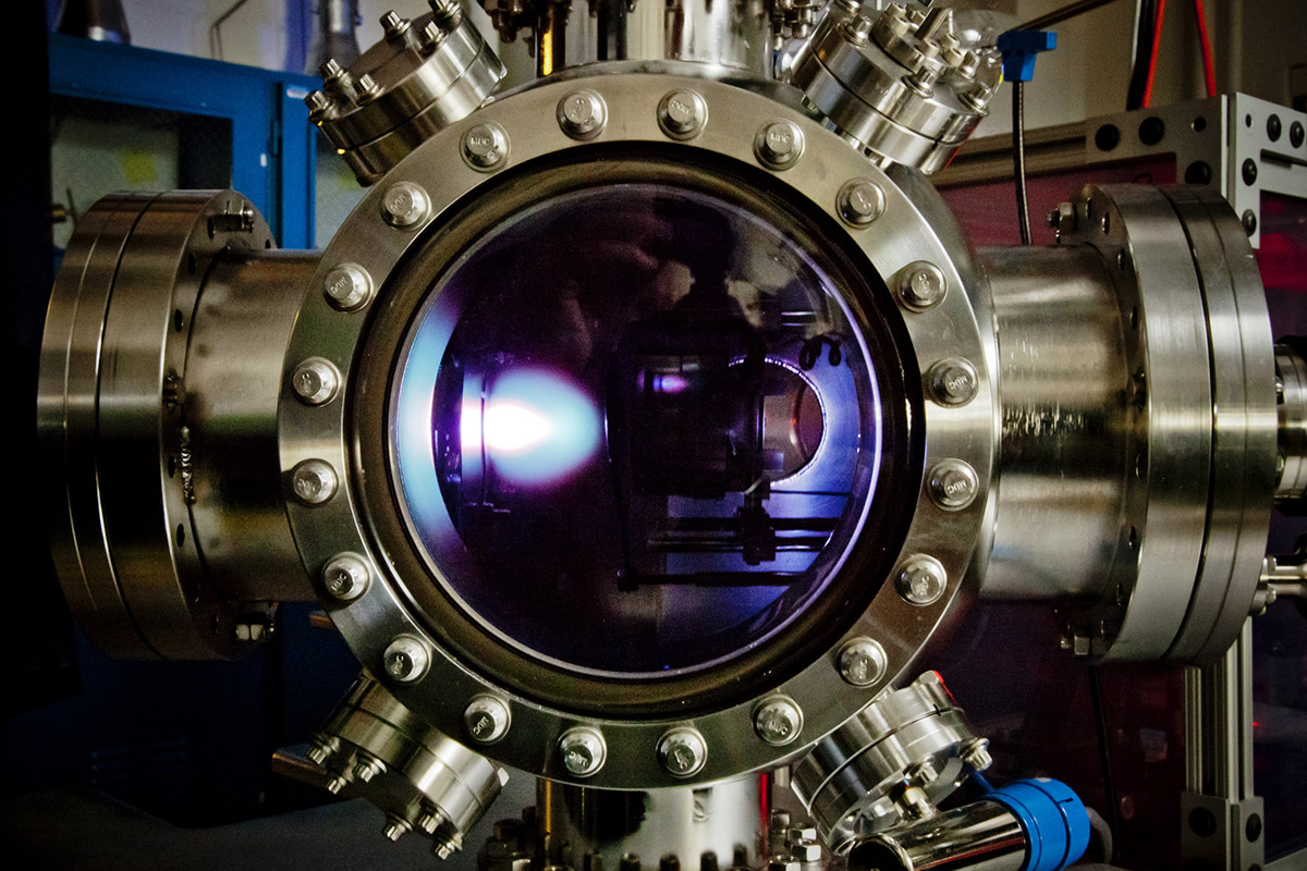 To make the new material, the thin film is first deposited via a pulsed-laser deposition process in this chamber. The bright “plume” you see is the laser hitting the target and depositing the material.