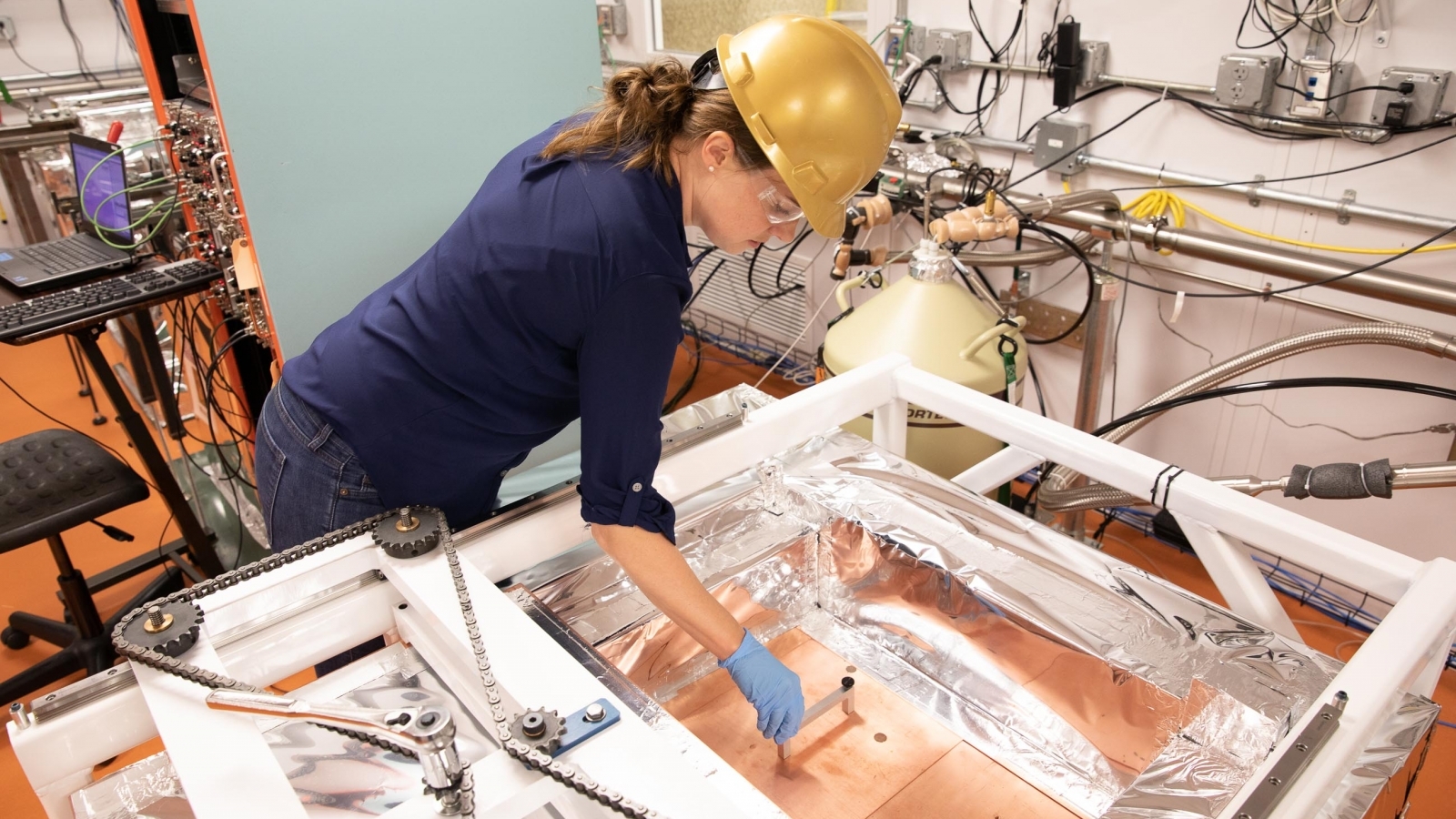Image - Brianna Mount, assistant professor of physics at Black Hills State University, at work in the Black Hills State University Underground Campus (BHUC) at Sanford Lab, where components of the LUX-ZEPLIN experiment were tested to learn the background radioactivity of the materials. (Credit: Matthew Kapust/Sanford Lab)
