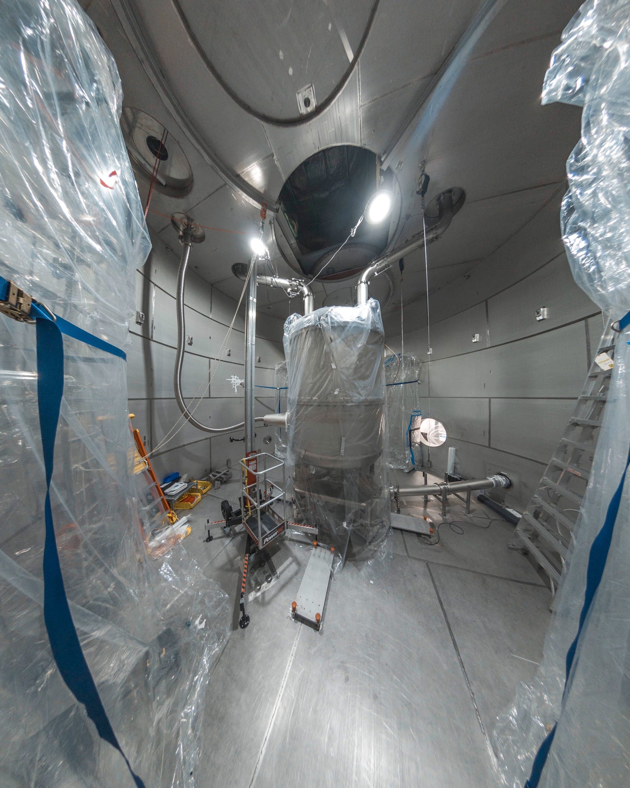Image - LZ's central detector, pictured here during assembly, is located inside a large water tank on the 4850 Level of Sanford Lab. LZ will search for theoretical dark matter particles known as WIMPs. (Credit: Nick Hubbard/Sanford Lab)
