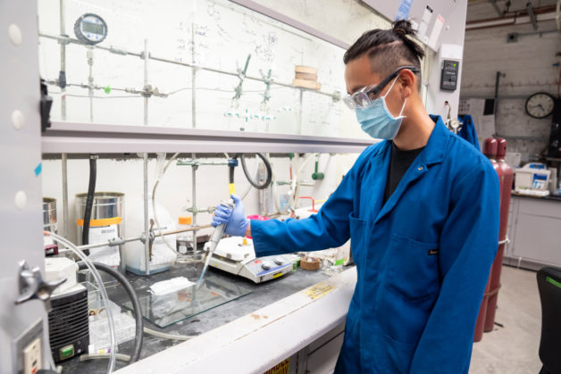 Ivan Jayapurna, a UC Berkeley materials science and engineering graduate student, preparing a sample film of a new biodegradable plastic. (Credit: Adam Lau/UC Berkeley)