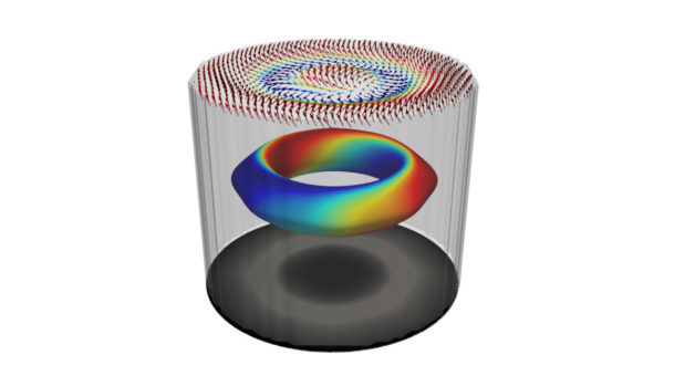 Artist’s drawing of characteristic 3D spin texture of a magnetic hopfion. Top layer shows a simulation of the spin structure viewed with surface-sensitive X-PEEM; bottom layer is a simulation of a bulk-sensitive X-ray transmission microscopy image; middle layer – colors indicate the varying direction of the spins showing the winding characteristic. The discovery could advance spintronics memory devices. (Credit: Peter Fischer and Frances Hellman/Berkeley Lab)