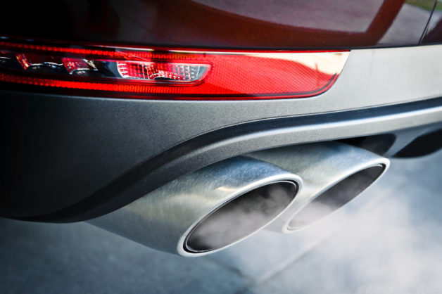 Stock image of carbon dioxide tailpipe emissions from a passenger vehicle