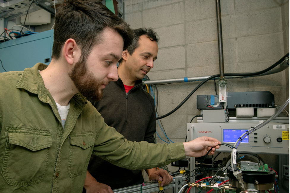 Will Larsen and Arun Persaud at the neutron test facility of the Fusion Science and Ion Beam Technology Program, configuring the alpha particle detector.