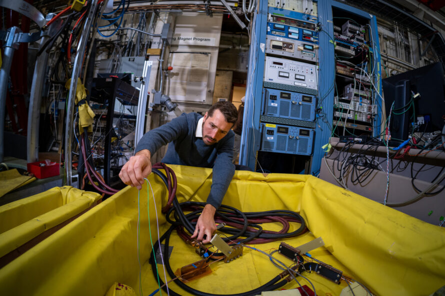 Reed Teyber, a research scientist, works a device he developed for measuring high-temperature superconducting magnets, at a machine shop in Building 58 at Lawrence Berkeley National Laboratory.