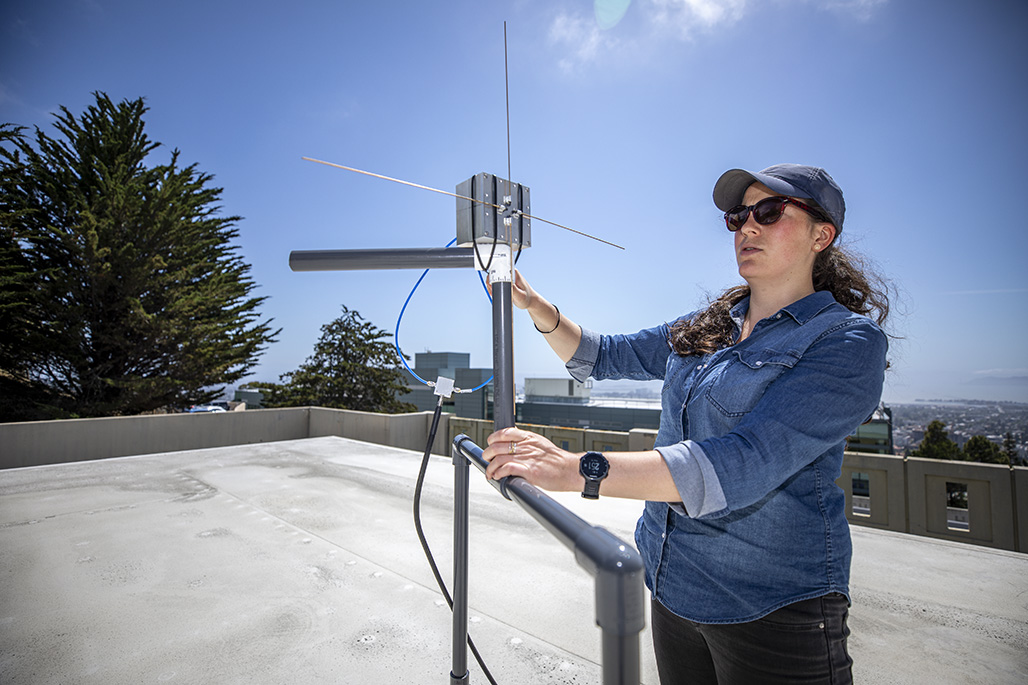 Researcher Kaja Rotermund makes adjustments to the LuSEE-Night test antenna at Berkeley Lab.