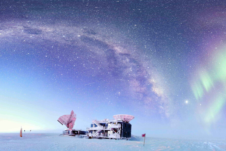 Telescopes at the South Pole against starry skies.