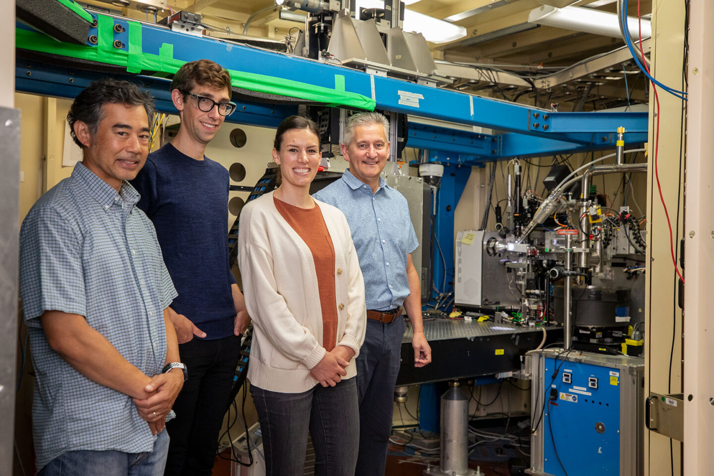 (Left to right) Anthony Rozales, Joshua Woods, Jen Wacker, and Marc Allaire at beamline 5.0.2 in the Advanced Light Source.