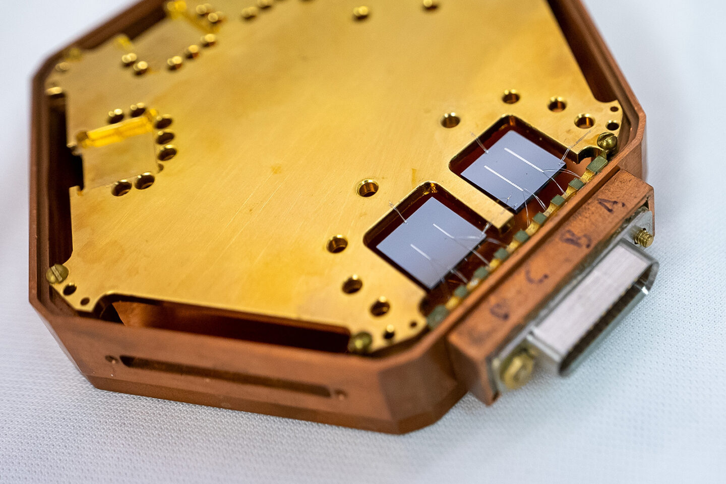 TESSERACT, a yellow hexagon-shaped detector.