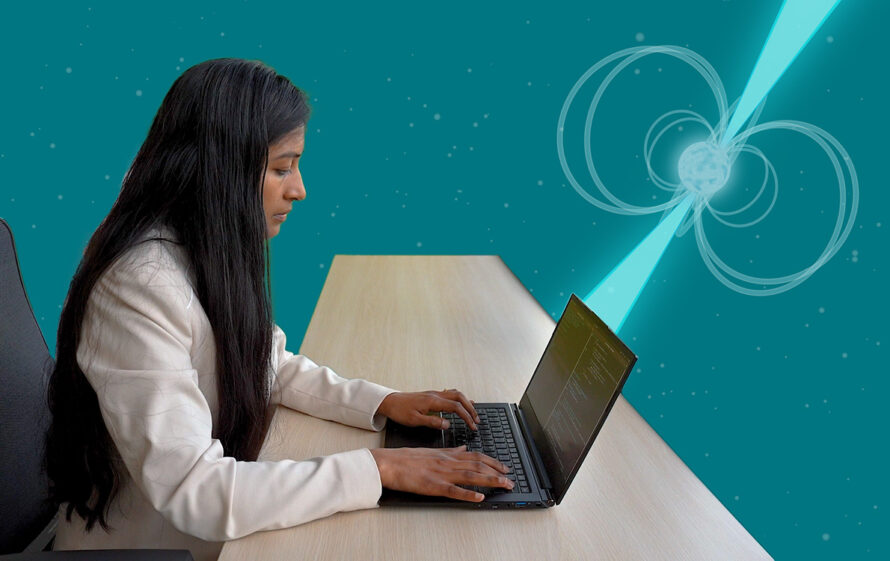 Revathi Jambunathan typing on a laptop. A graphic depiction of a pulsar is in the background.
