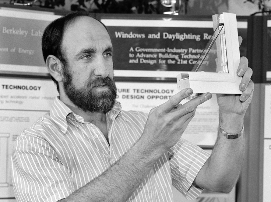Stephen Selkowitz holding a triple pane window