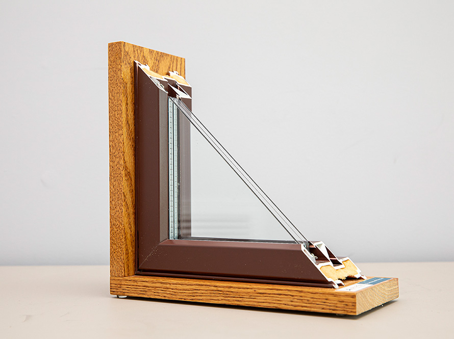 A triple pane window on an off-white table
