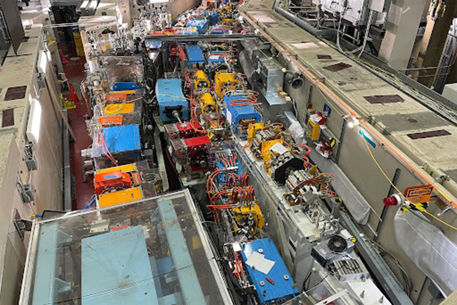 A birdseye view of the existing ALS storage ring with colorful sections and wires.