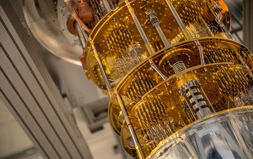 Large silvery-gray metallic device with long copper wires on the exterior.