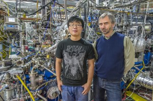 Eryin Wang (left)and Alexei Fedorov at ALS Beamline 12.0.1 where the induced high temperature superconductivity in a topological insulator was confirmed. (Photo by Roy Kaltschmidt)