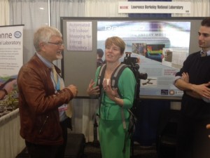 RAPMOD's inventor, Phil Haves (EETD) helps ARPA-E Acting Director Cheryl Martin try out the module. 