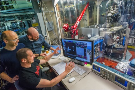 Goldberg, with team members Iacopo Mochi and Markus Benk, gather around the control center for the SHARP microscope, an extreme-ultraviolet-wavelength microscope dedicated to photomask imaging for the commercialization of EUV photolithography.
