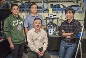  (From left) Yu Ye, Xiaobo Yin, Xiang Zhang and Ziliang Ye used  second-harmonic generation imaging to discover strong nonlinear optical resonance along the edges of single layers of molybdenum disulfide. (Photo by Roy Kaltschmidt)