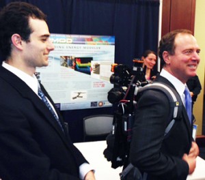 UC Berkeley engineering grad student Eric Turner looks on as U.S. Rep. Adam Schiff, D-Calif., a member of the House Appropriations Committee, tries on the energy-mapping backpack system invented by a team of researchers from Berkeley and Berkeley Lab. (UC Berkeley photo by Michelle Moskowitz)